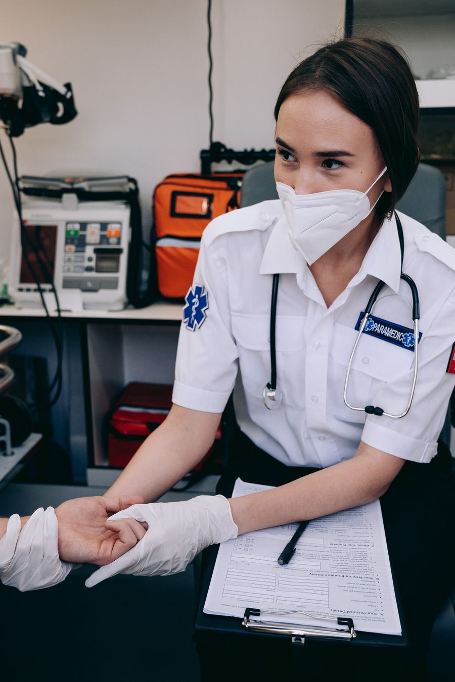 Caring medical professional holding a patient's hand